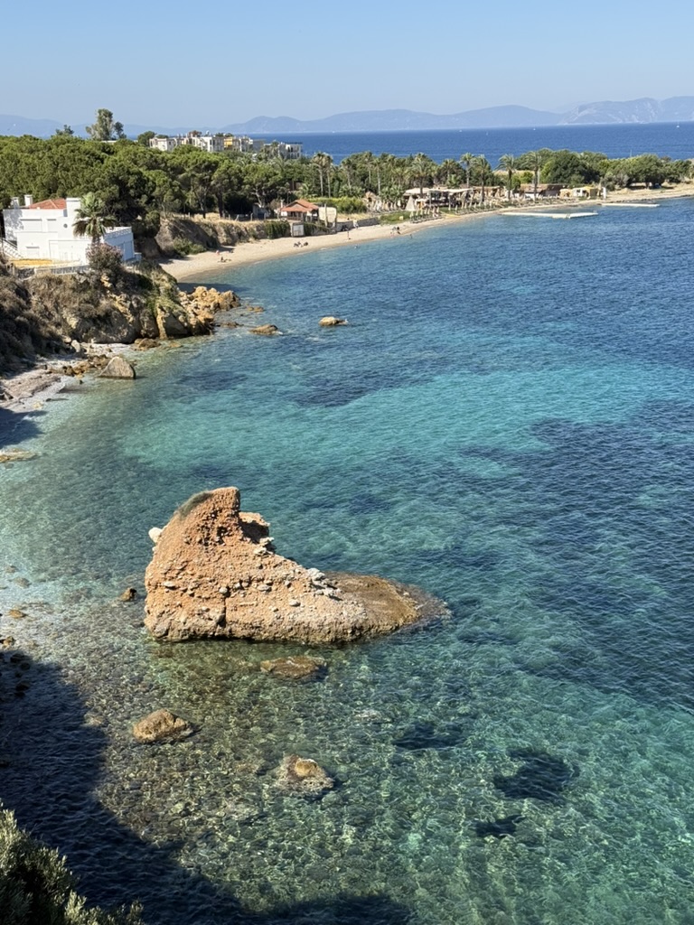 A rocky coastal cove with clear turquoise water