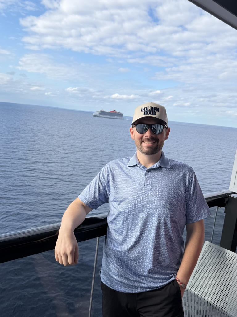 Chris of Golden Hour Travel aboard a Virgin Voyages ship.